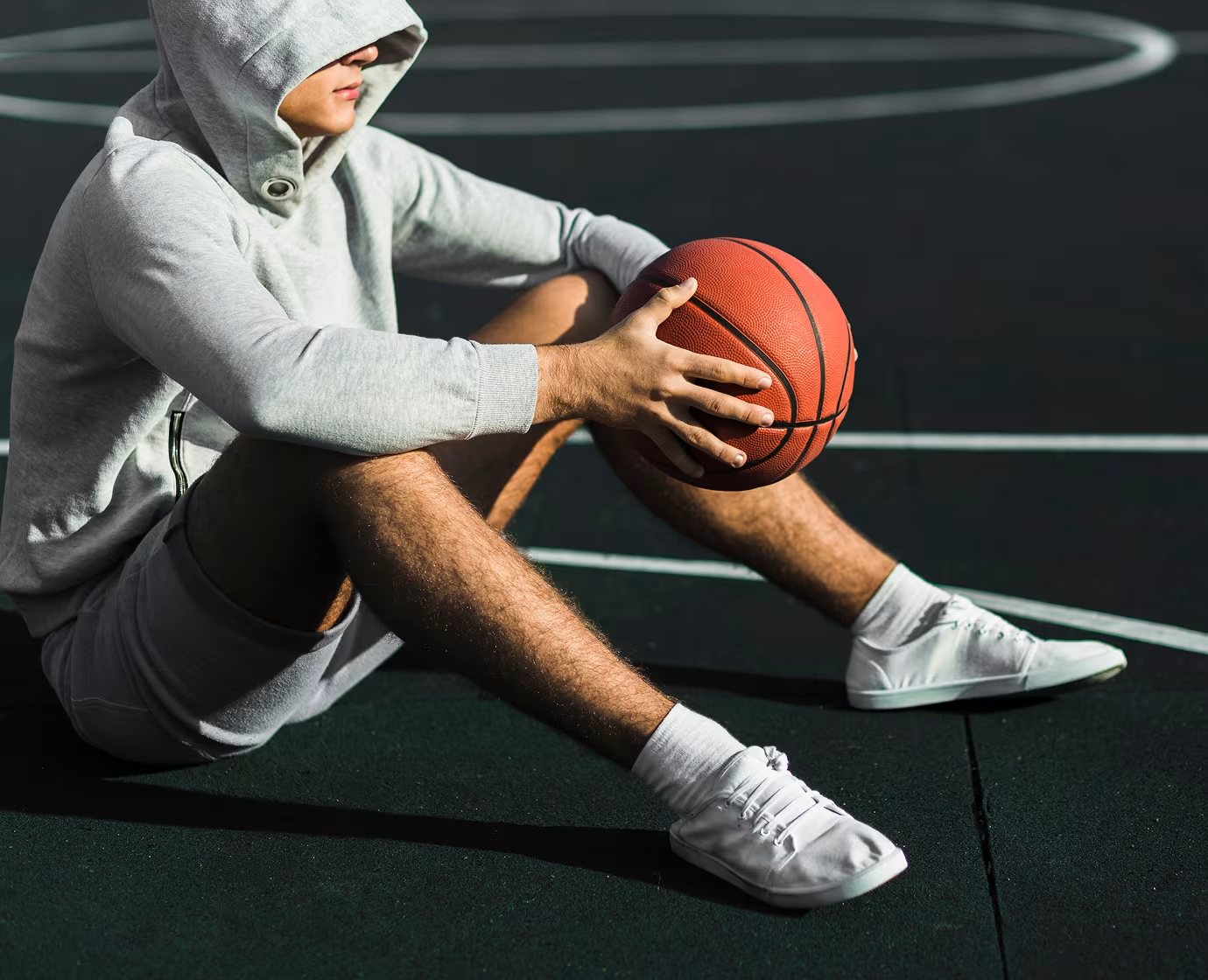 Pre-owned sneakers on a basketball court